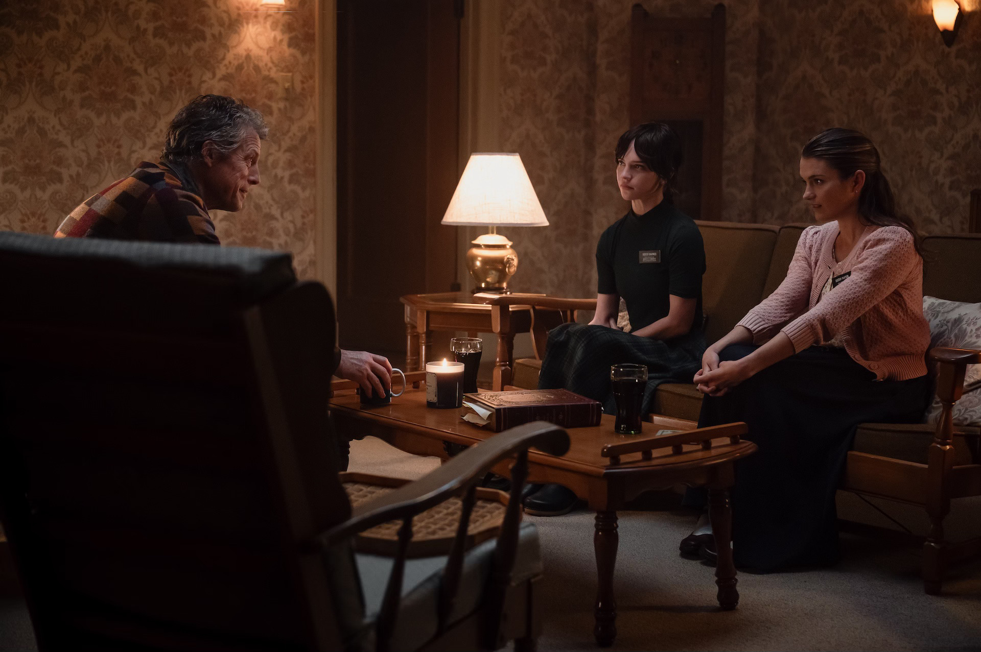 Hugh Grant, Sophie Thatcher, and Chloe East in Heretic 